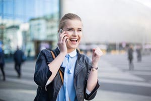 Woman closing a trade over the phone